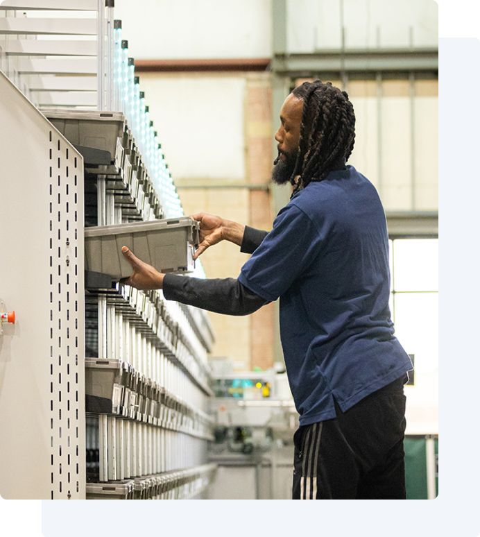 Employee putting inventory on a shelf