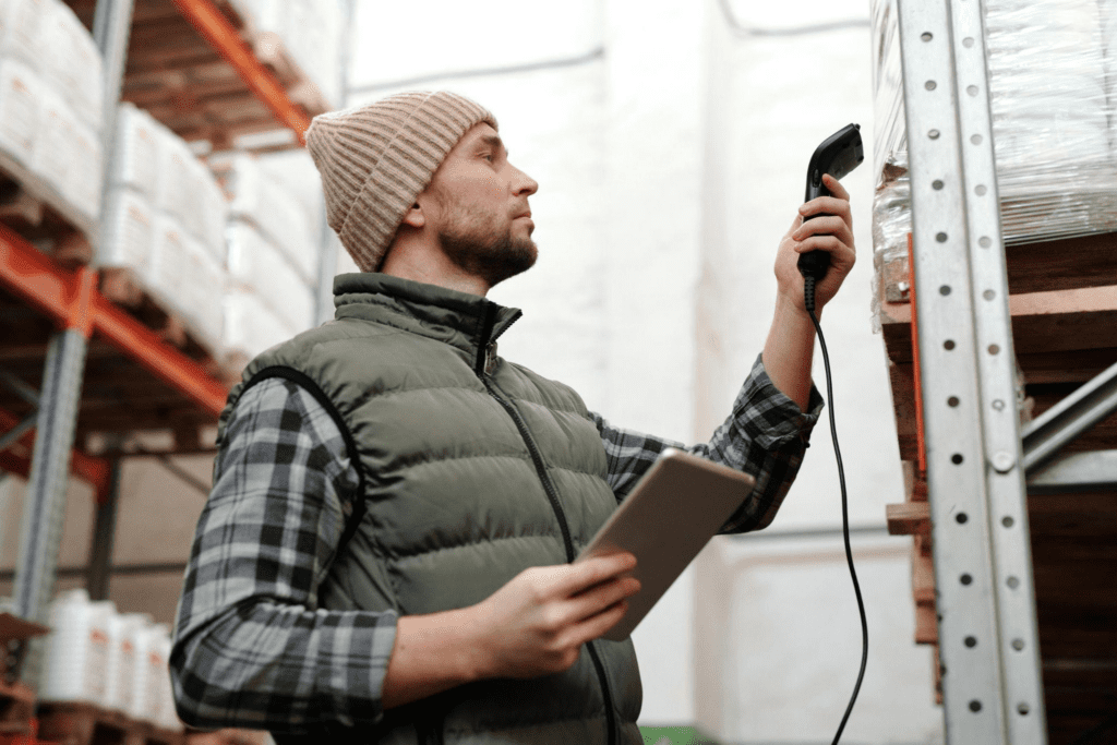 A worker scans items in a warehouse – AMS Fulfillment