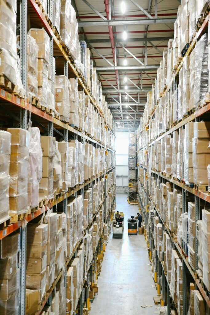 Employees manage stocked shelves in a warehouse – AMS Fulfillment